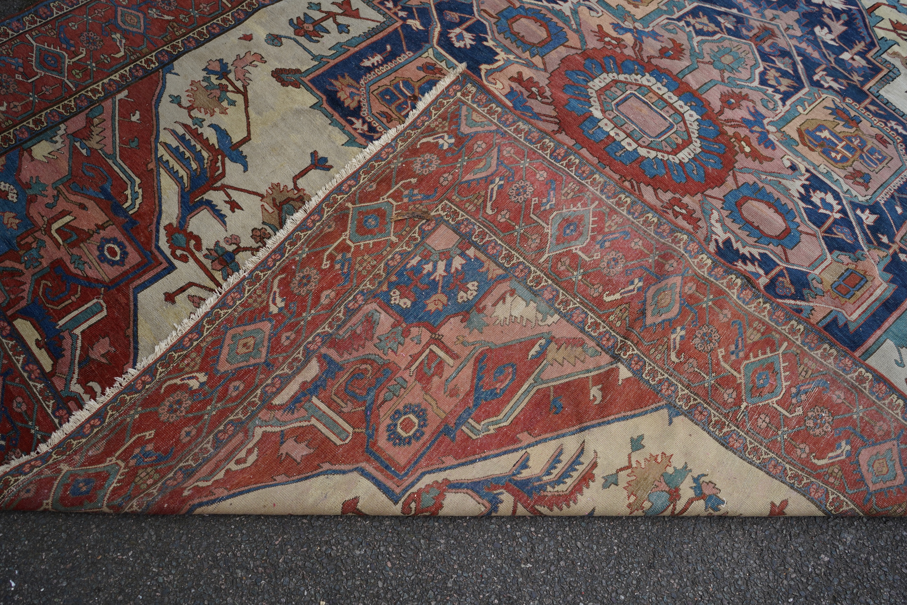 An early 20th century Heriz ivory ground carpet